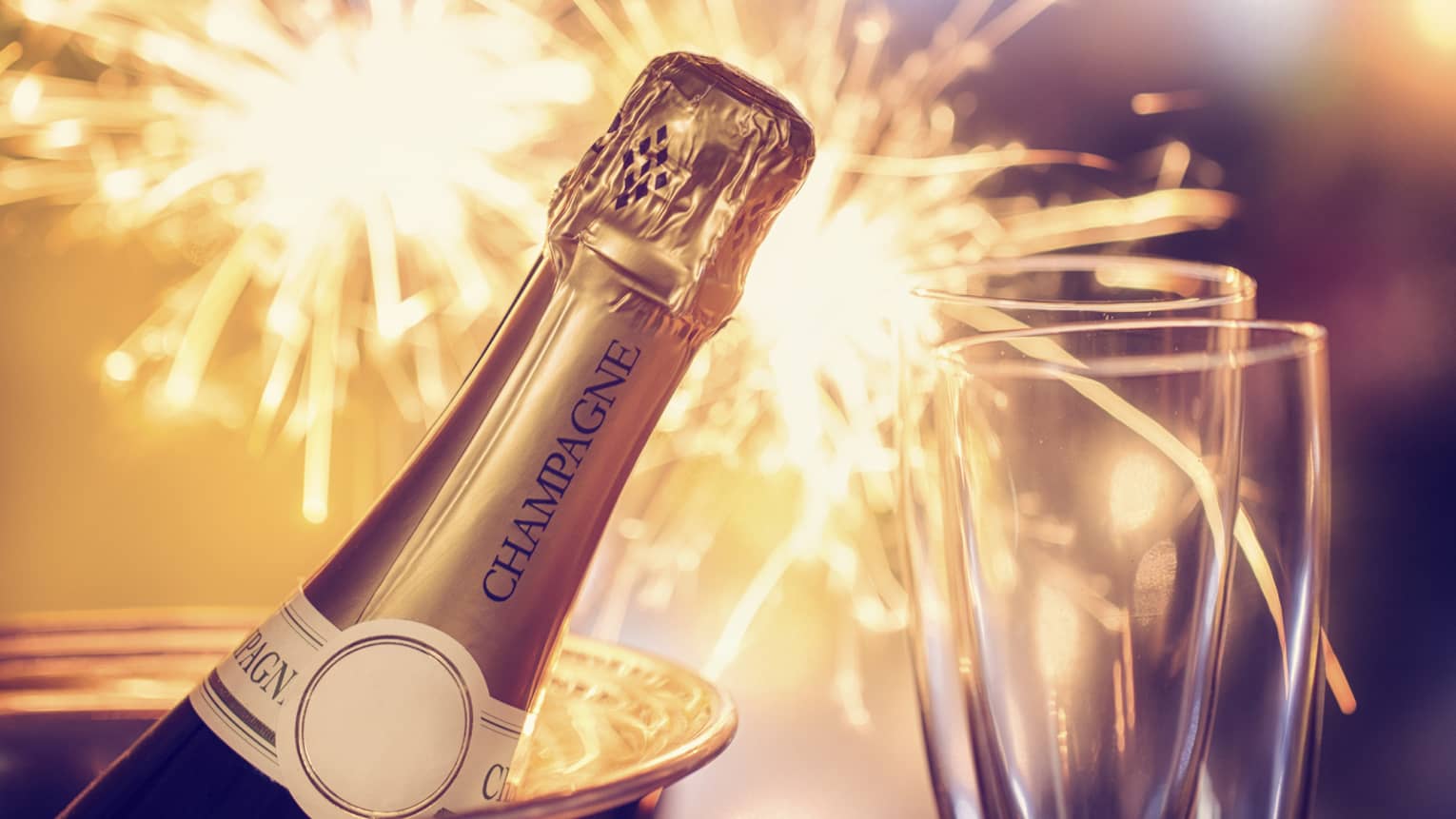 Fireworks, champagne and two champagne flutes