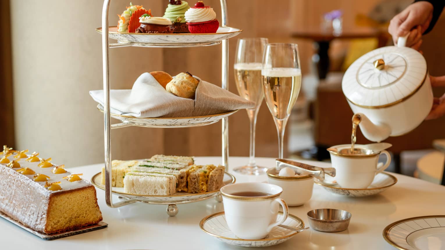 Afternoon tea with pastries and champagne in Rotunda Lounge