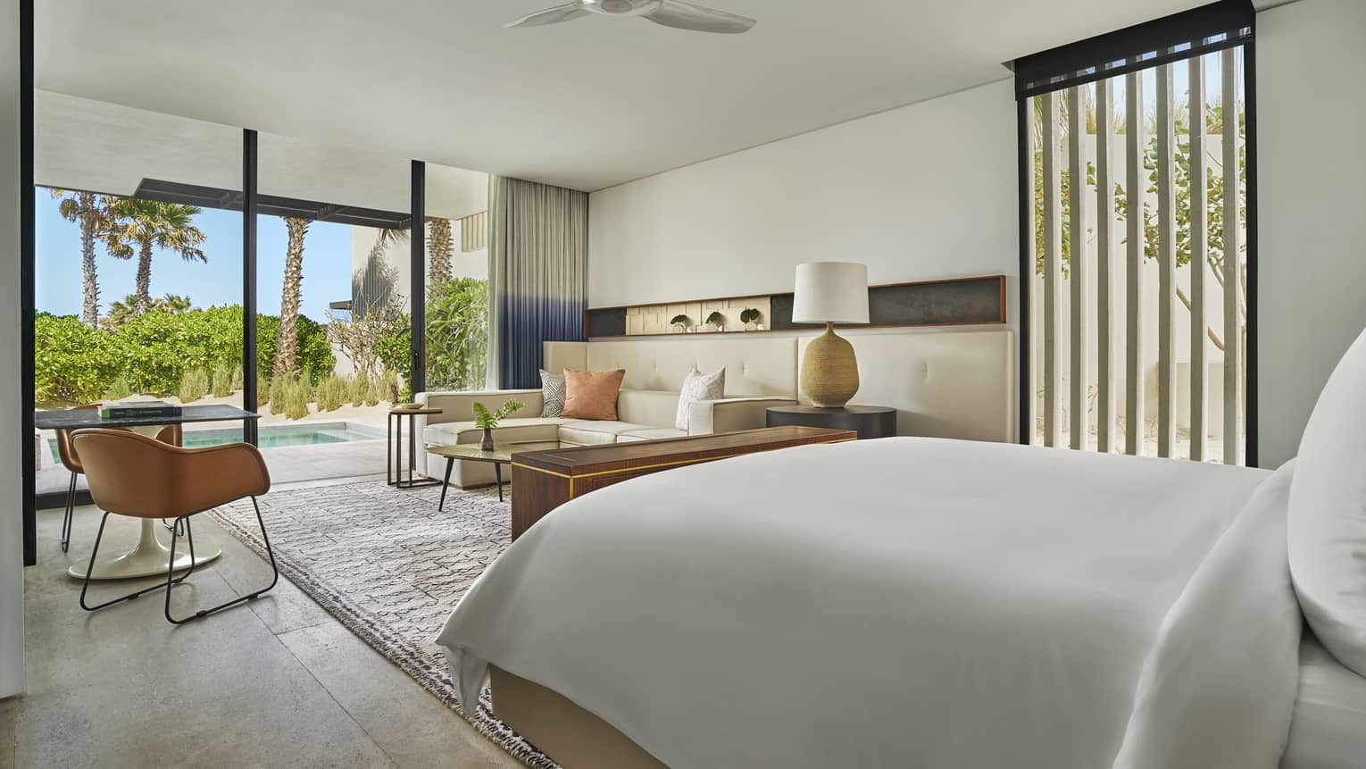 Studio-style resort suite with king bed, living area, and private walk-out terrace with plunge pool at Four Seasons Resort Los Cabos