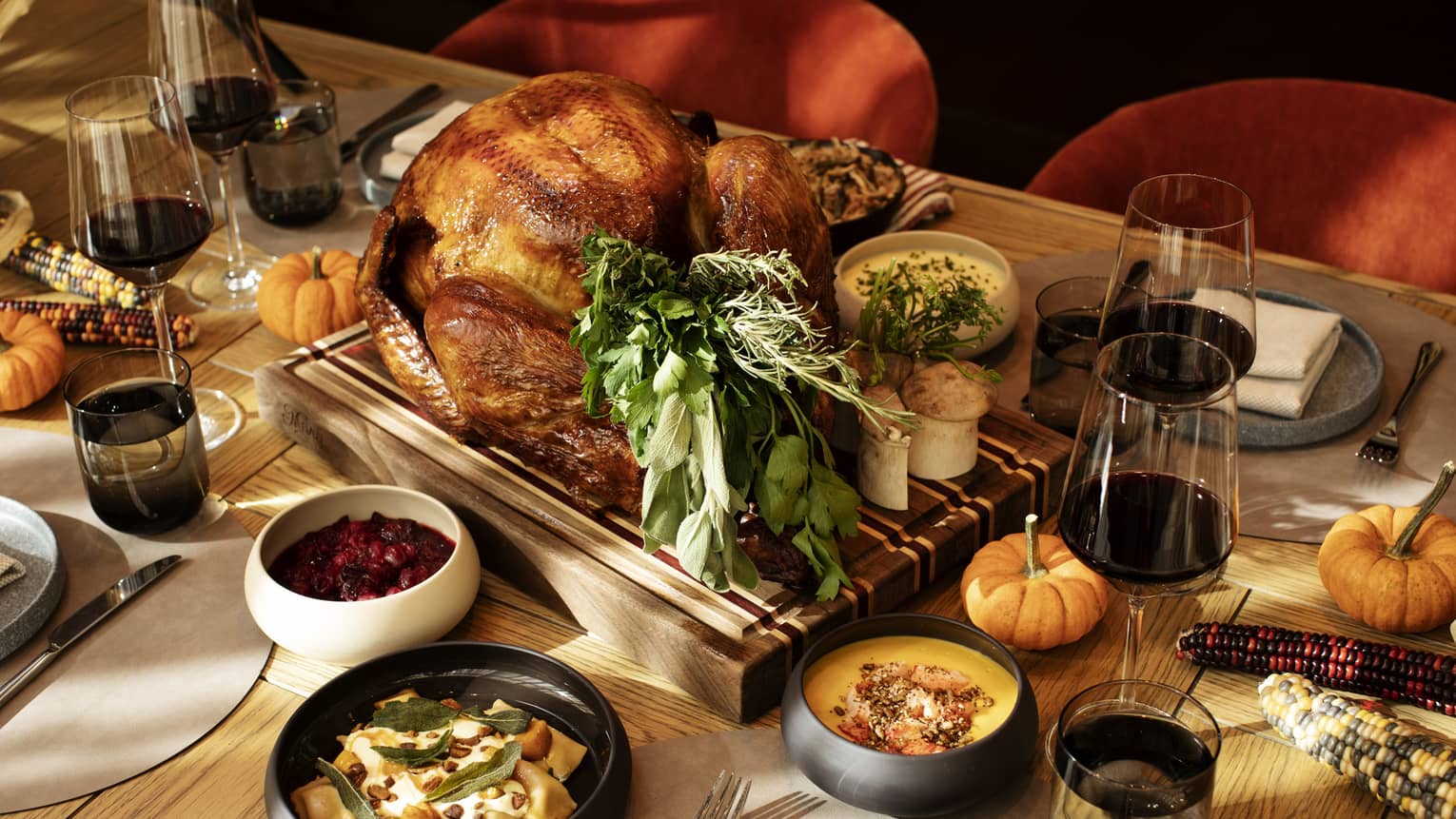 An assortment of autumn or Thanksgiving food, including turkey.