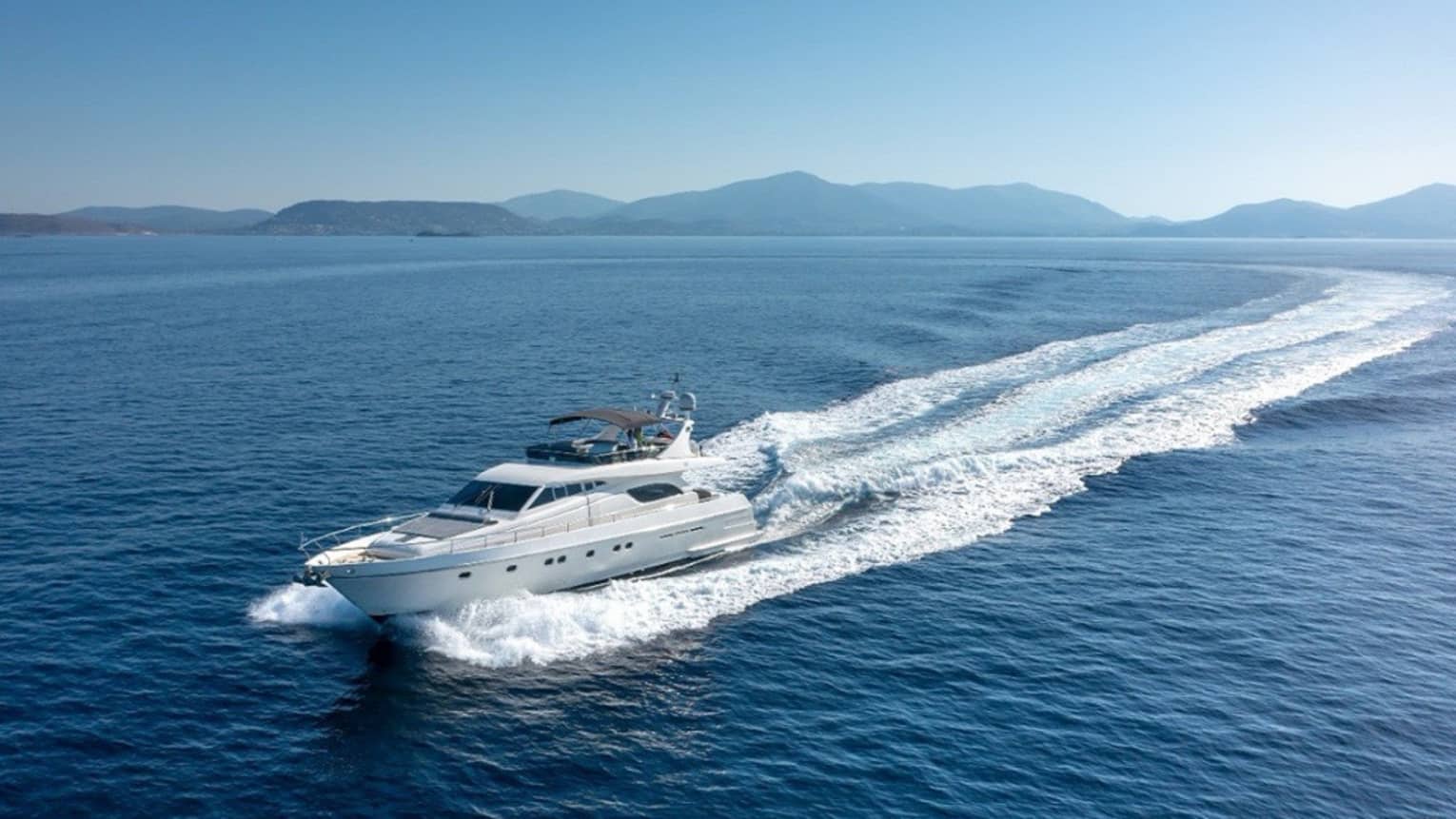 Yacht cruising crystal-blue waters