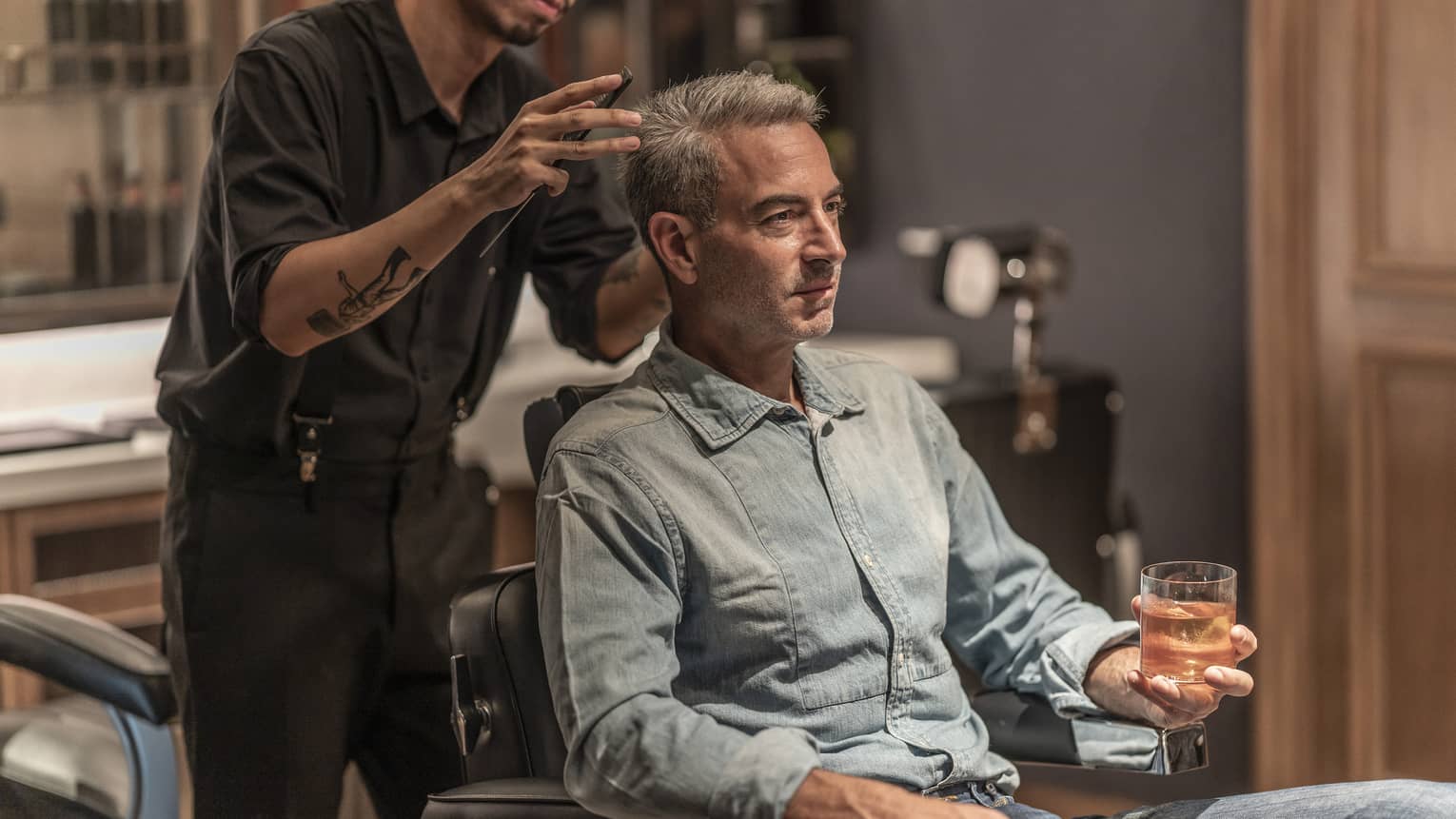 Man receives haircut in the Spa's barbershop