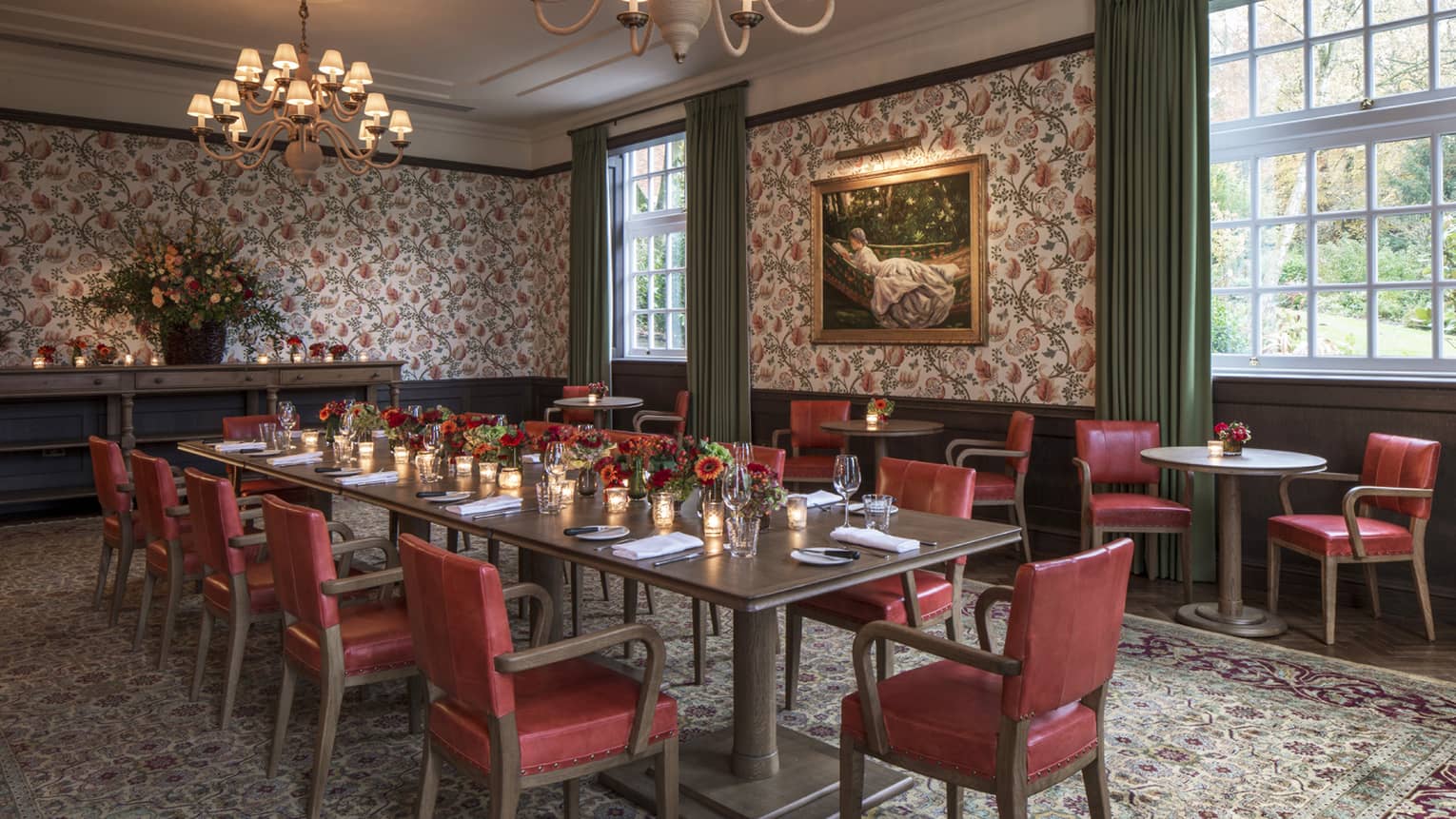 Fox Hollow private dining table lined with red leather chairs in room with English country decor