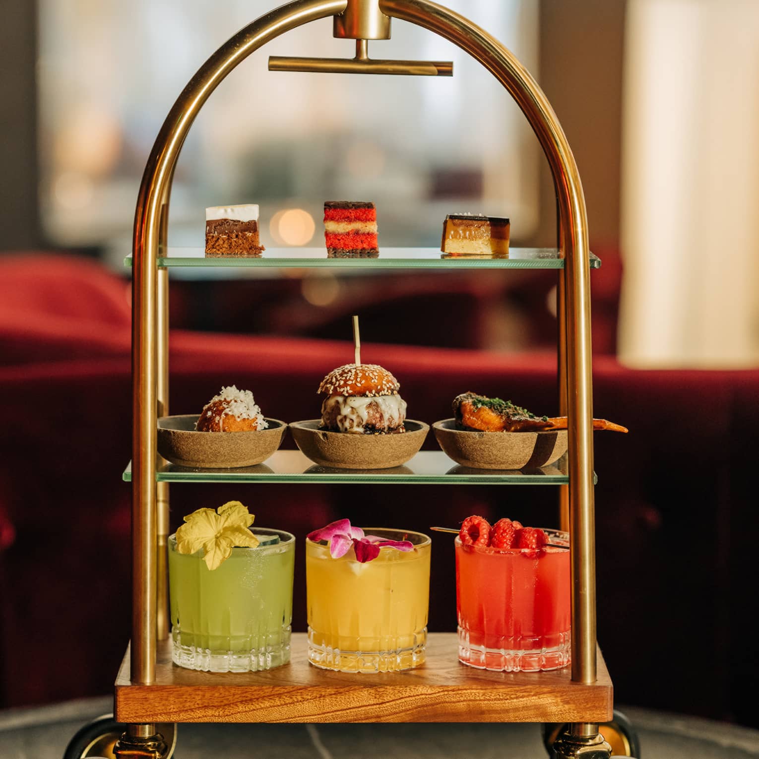 Three-tiered beverage and pastry tray shaped like a miniature luggage cart