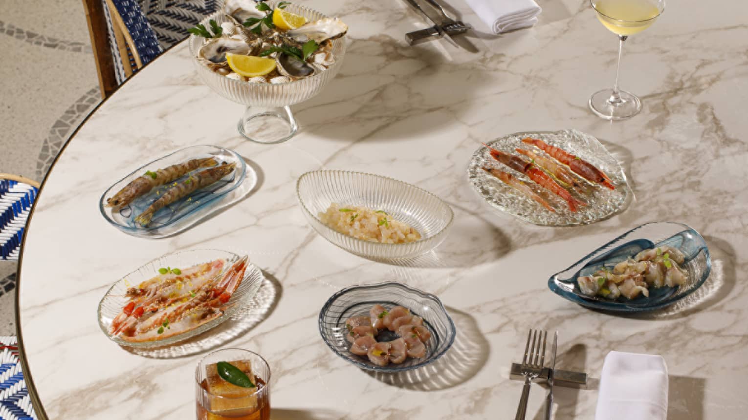 An array of plated food items and drinks set out on a table