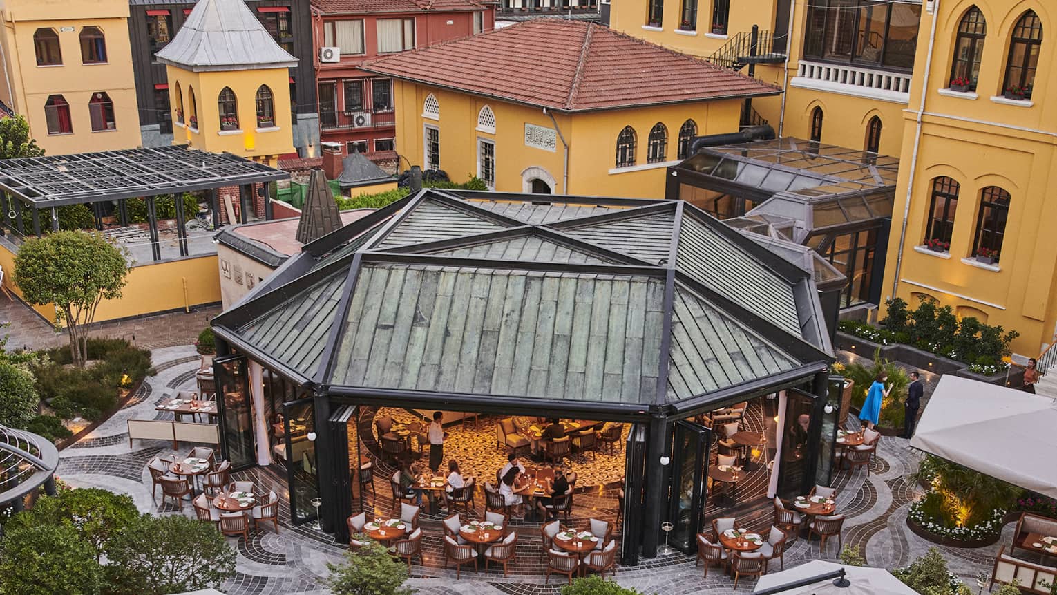 An outdoor eating area with a large covering.