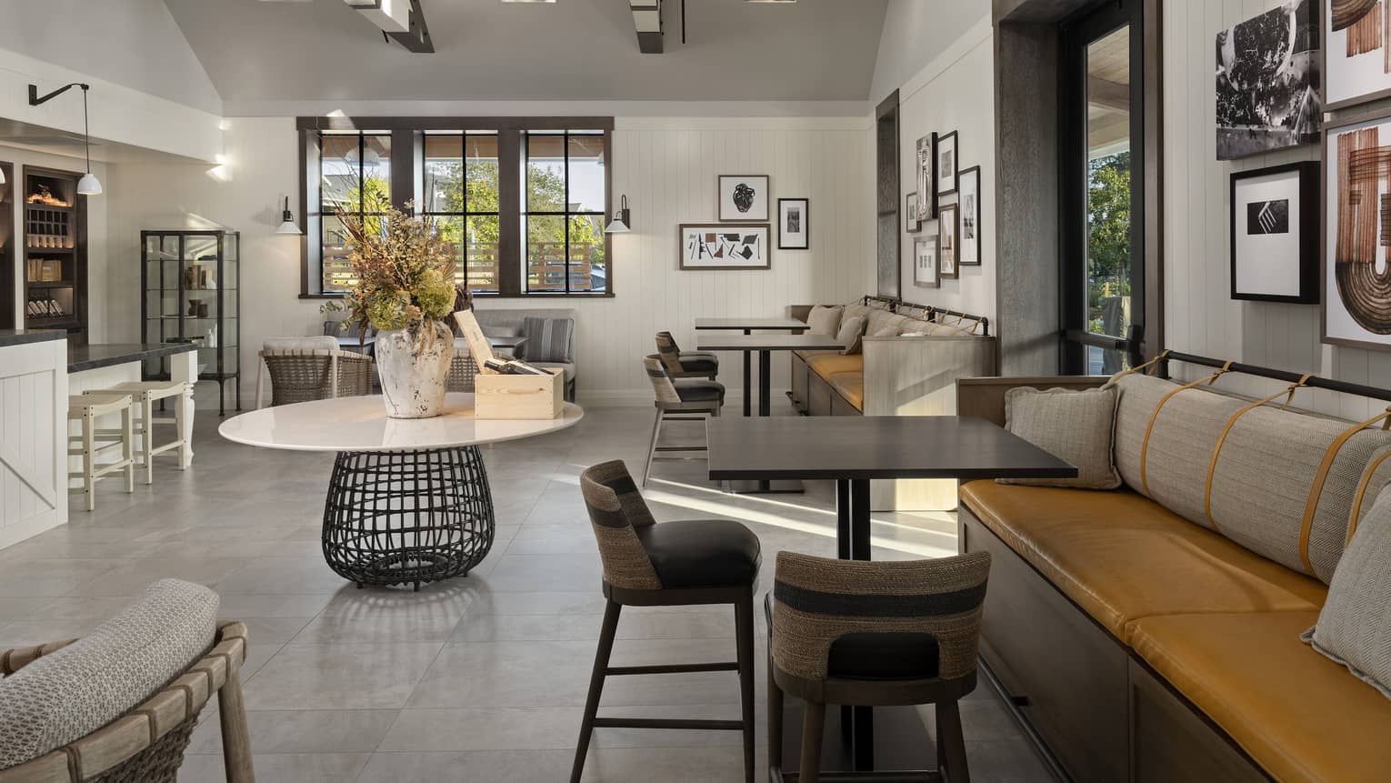 A large room with many seats and an eclectic style.