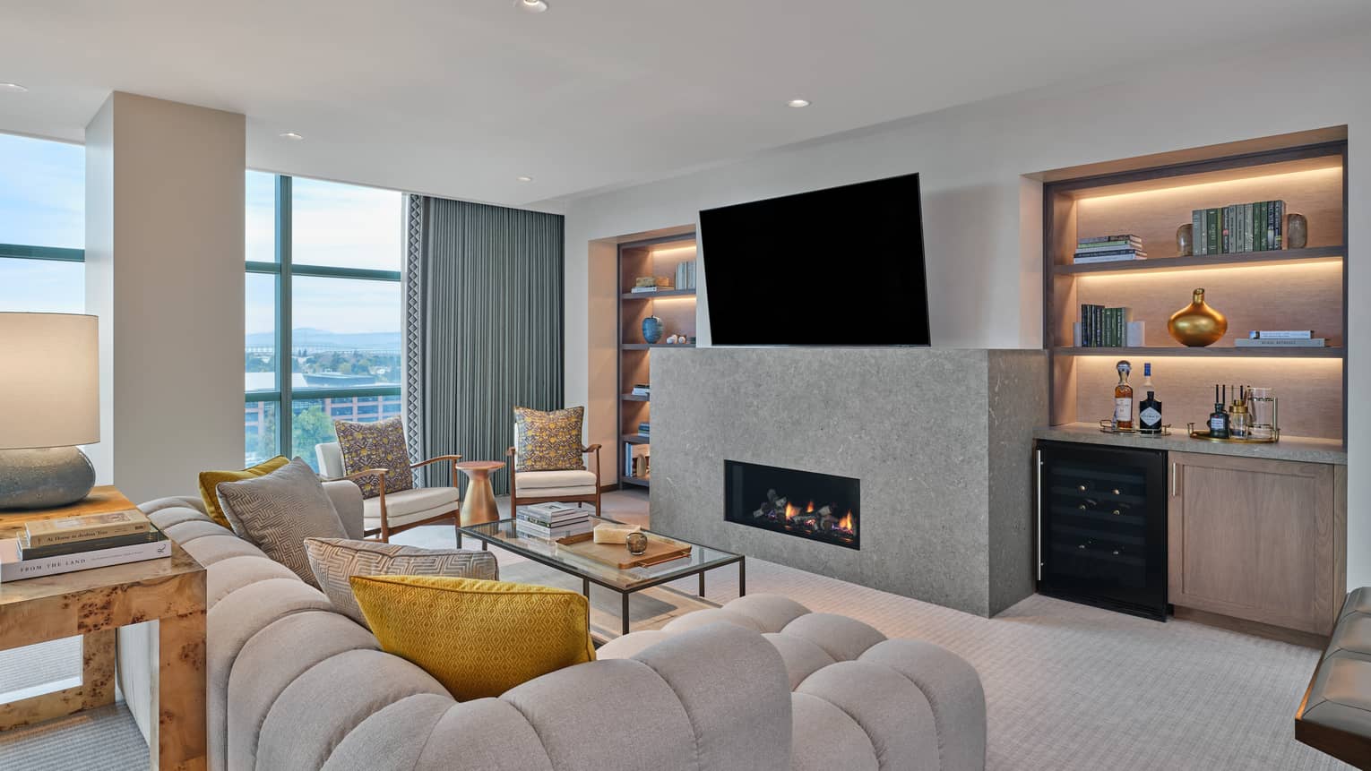 Living room with modern sofa, fireplace and large TV