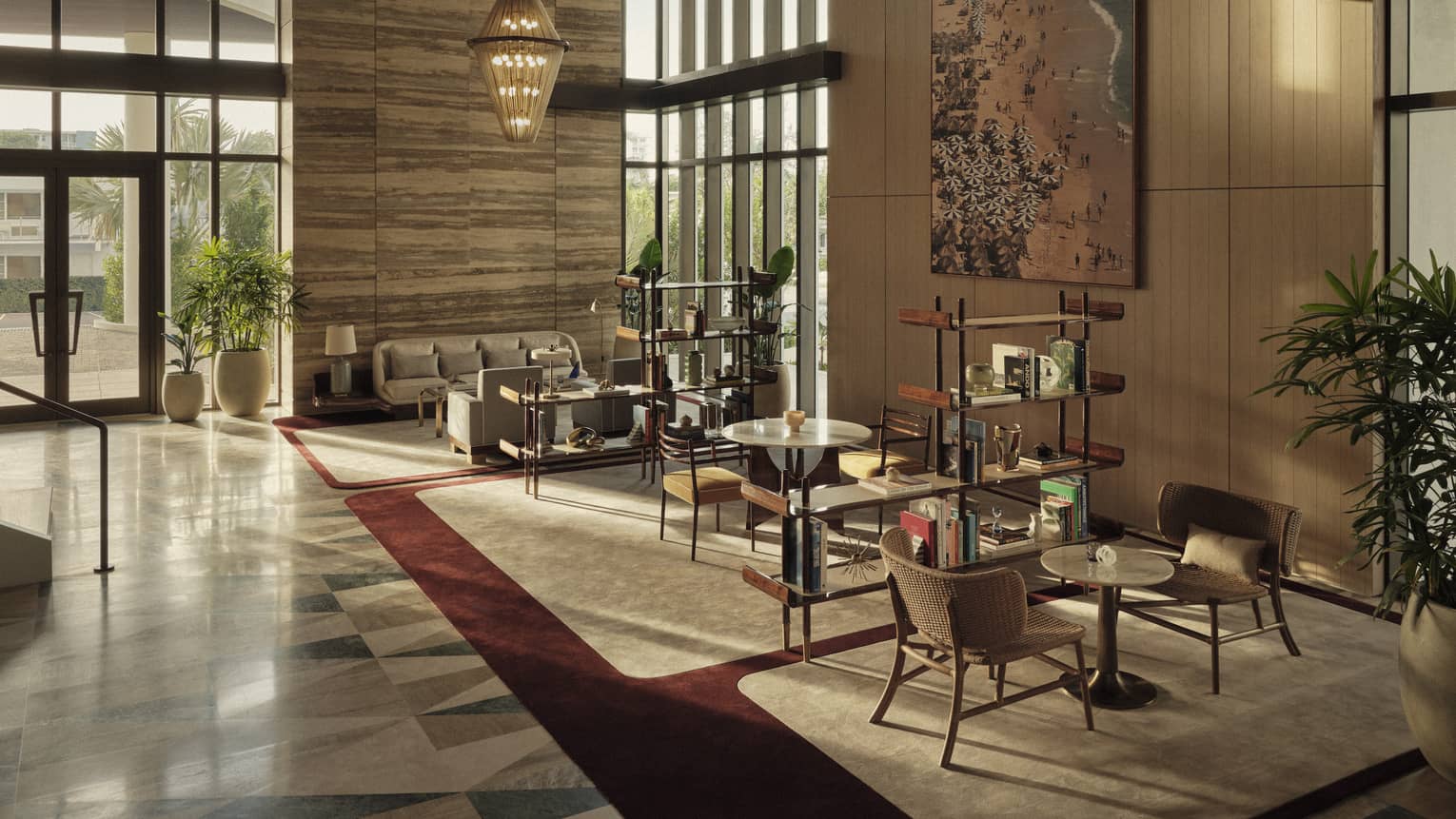 A lobby seating area with various chairs and sofa, as well as bookshelves and art.