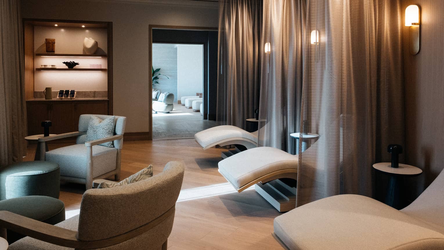 A spa area with lounge chairs illuminated by natural light