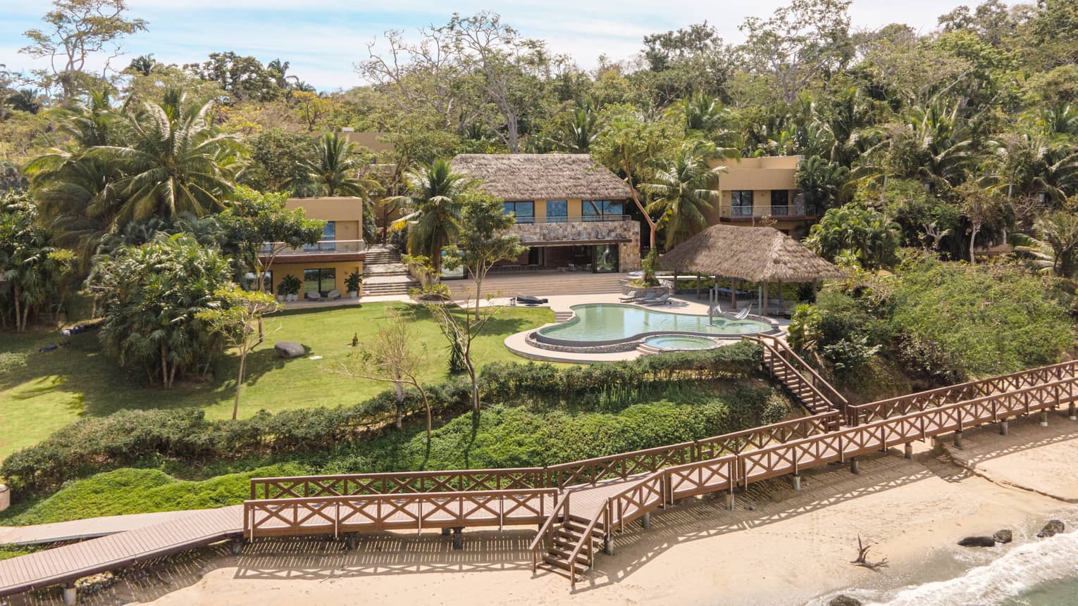 Aerial view of residence, pool and boardwalk