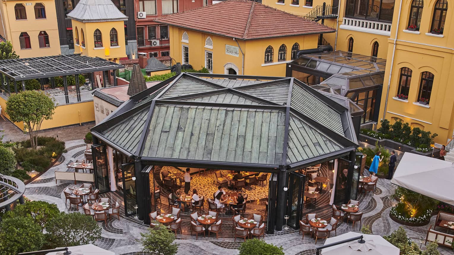An outdoor eating area with a large covering.