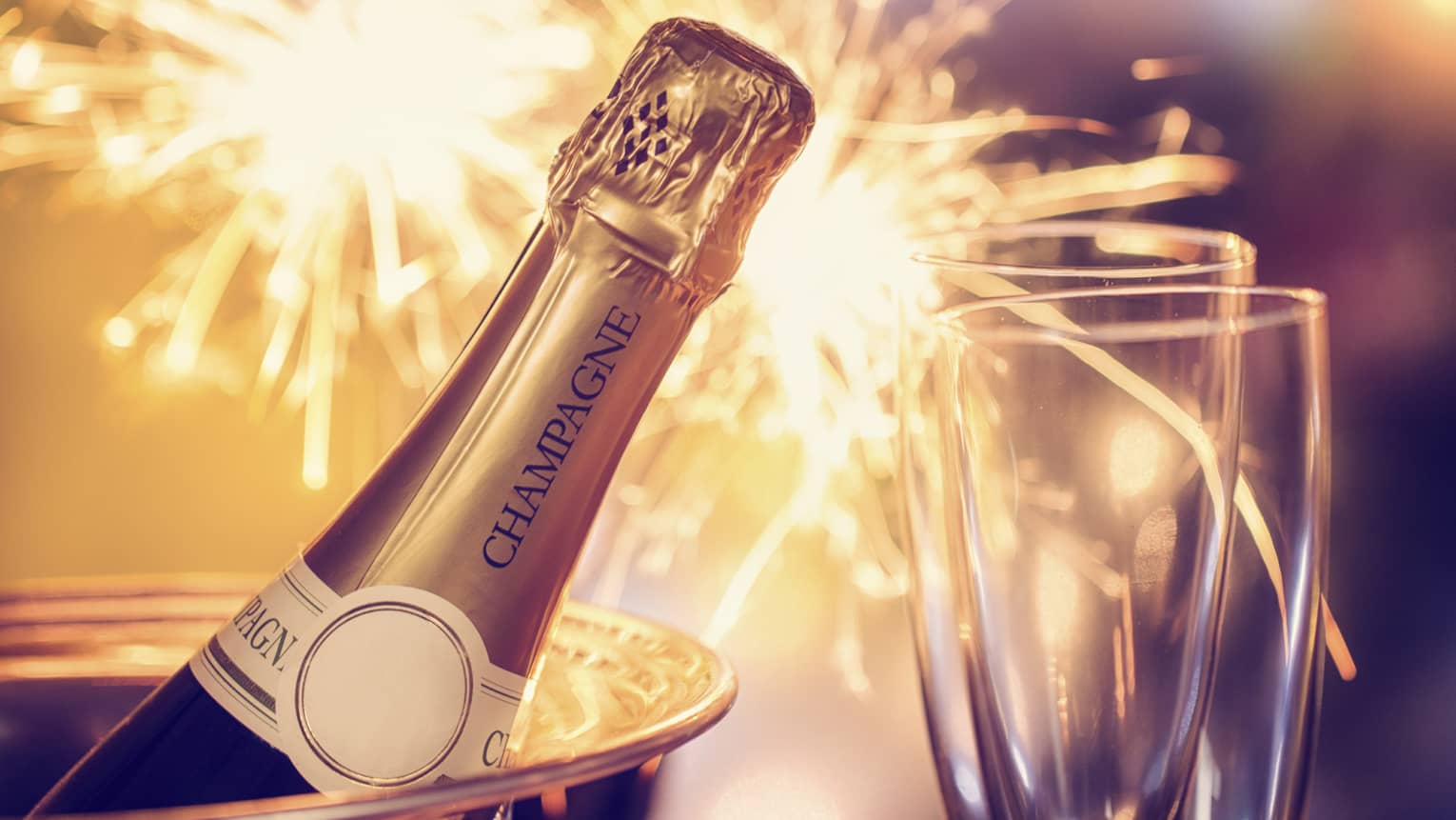 Fireworks, champagne and two champagne flutes