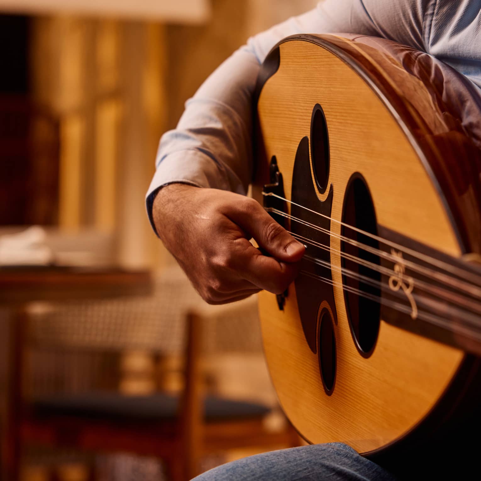 Close up of a hand strumming a guitar