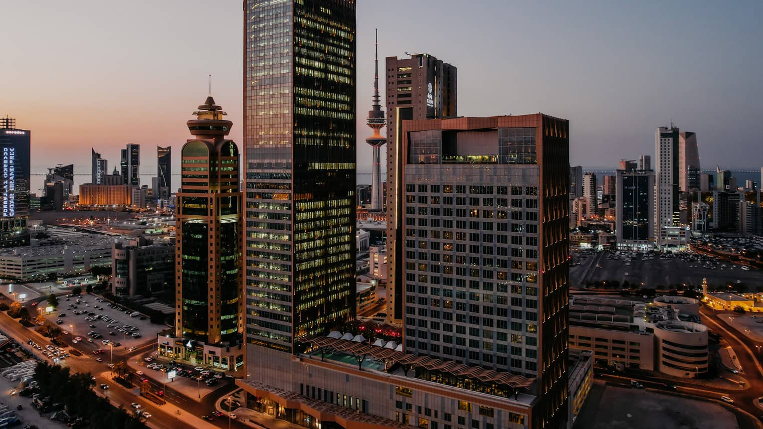 An outside view of the Kuwait building above the bustling streets.