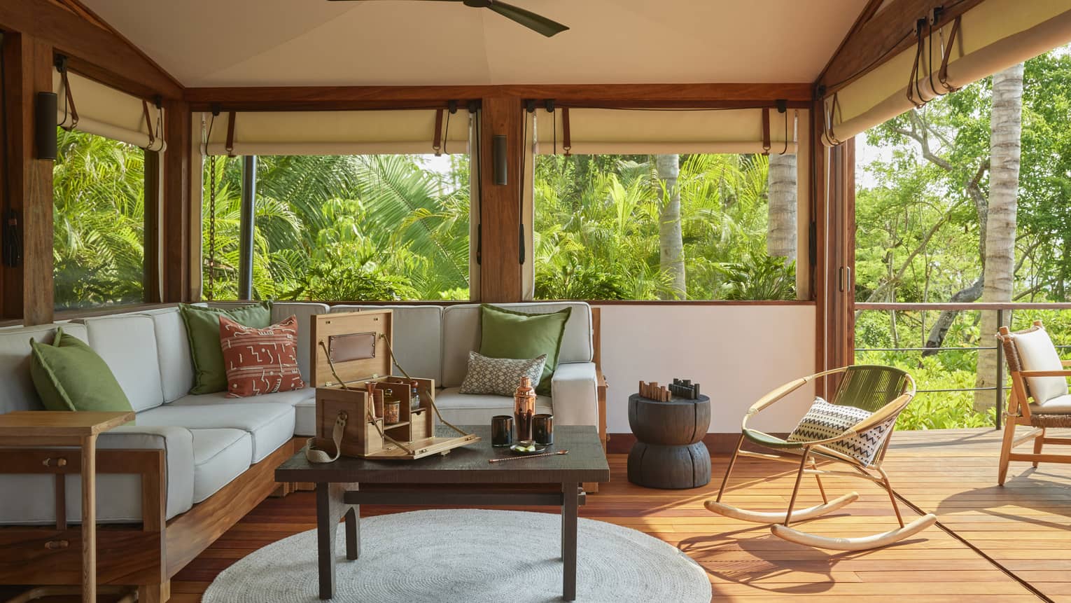 Living room of luxury tent with sofa, coffee table and wooden floors