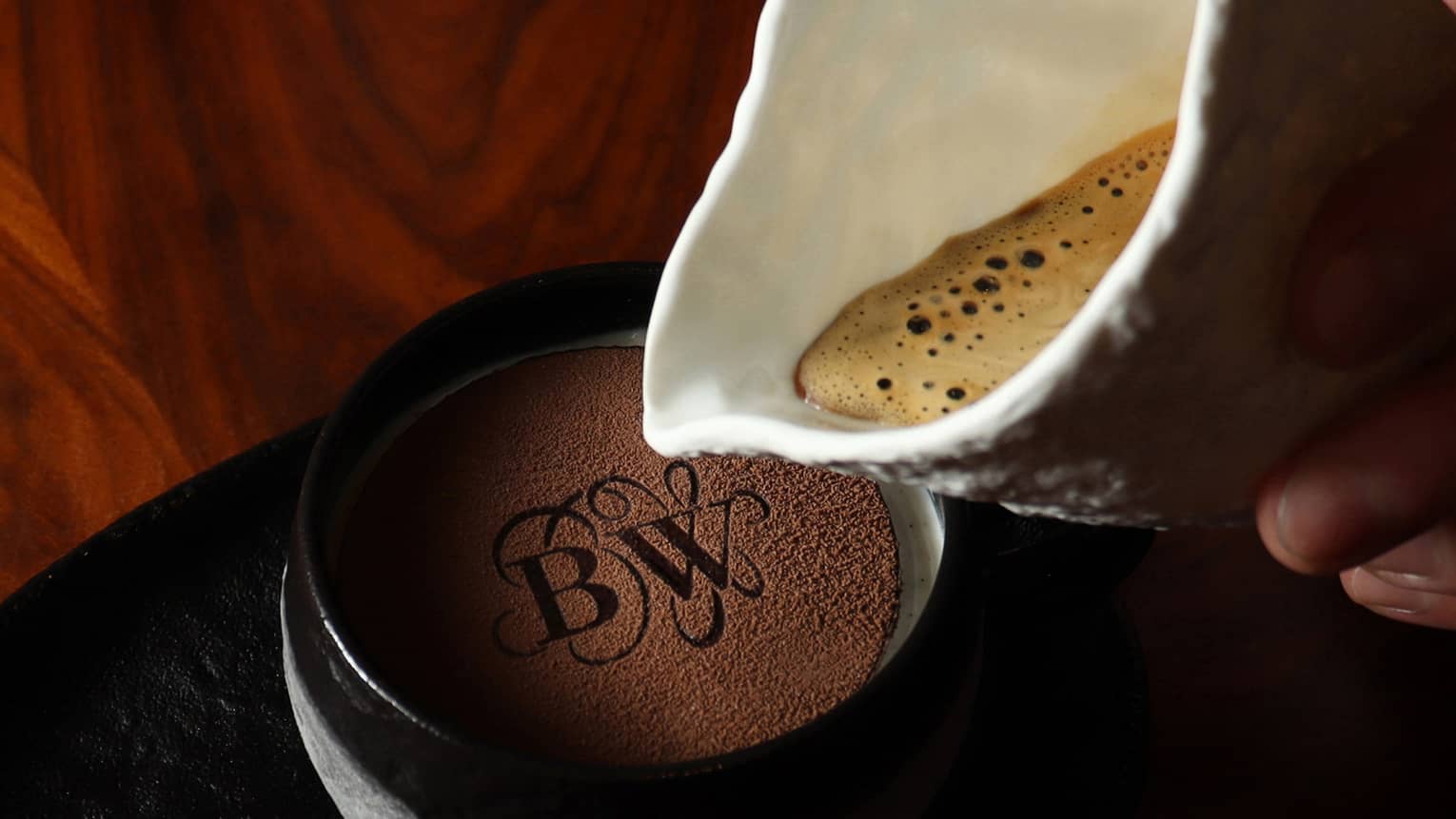 Affogato with vanilla gelato and chocolate discs.