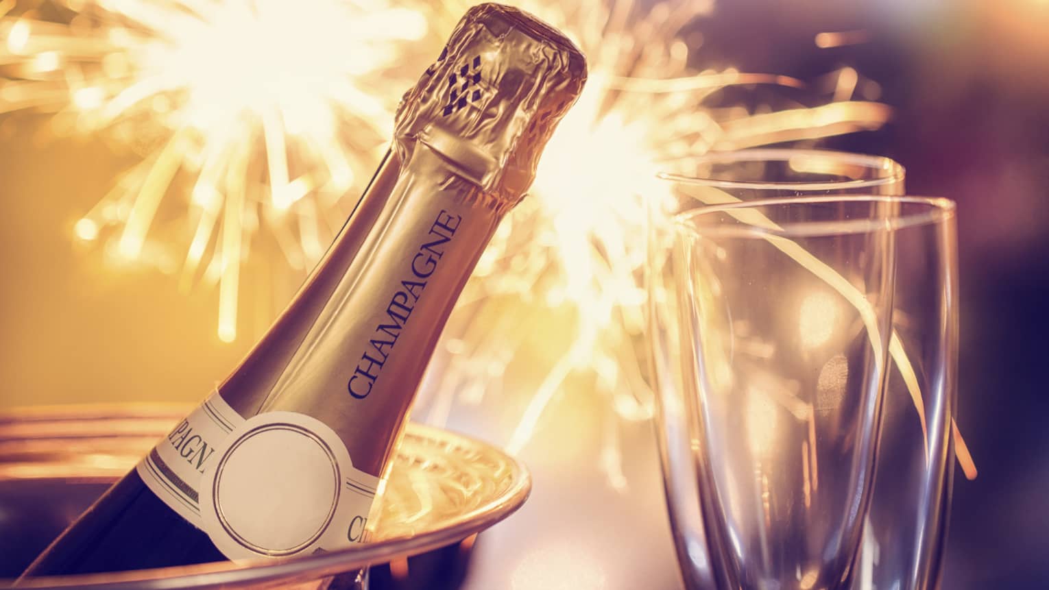 Fireworks, champagne and two champagne flutes