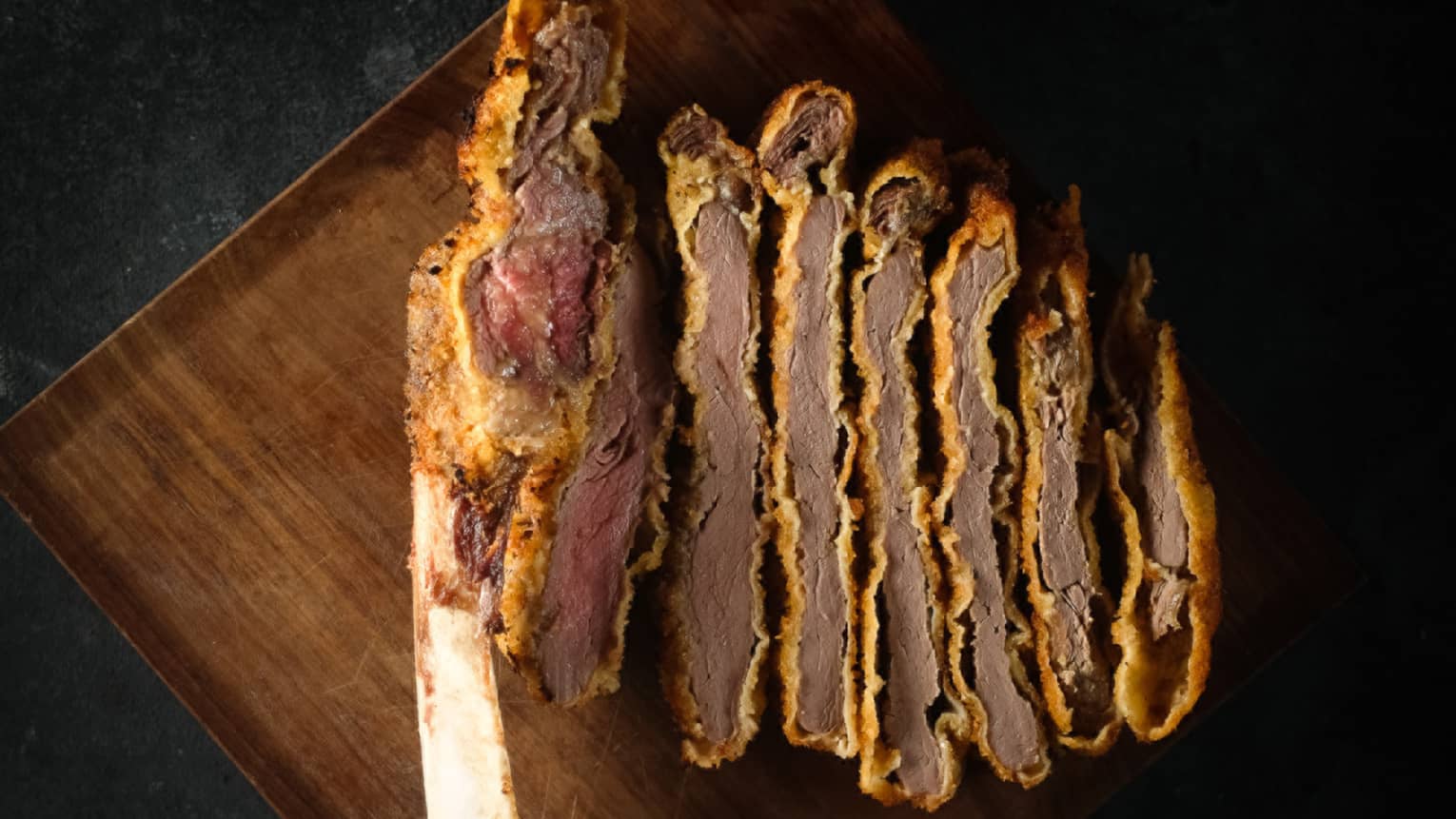 Sliced meat on a tray.
