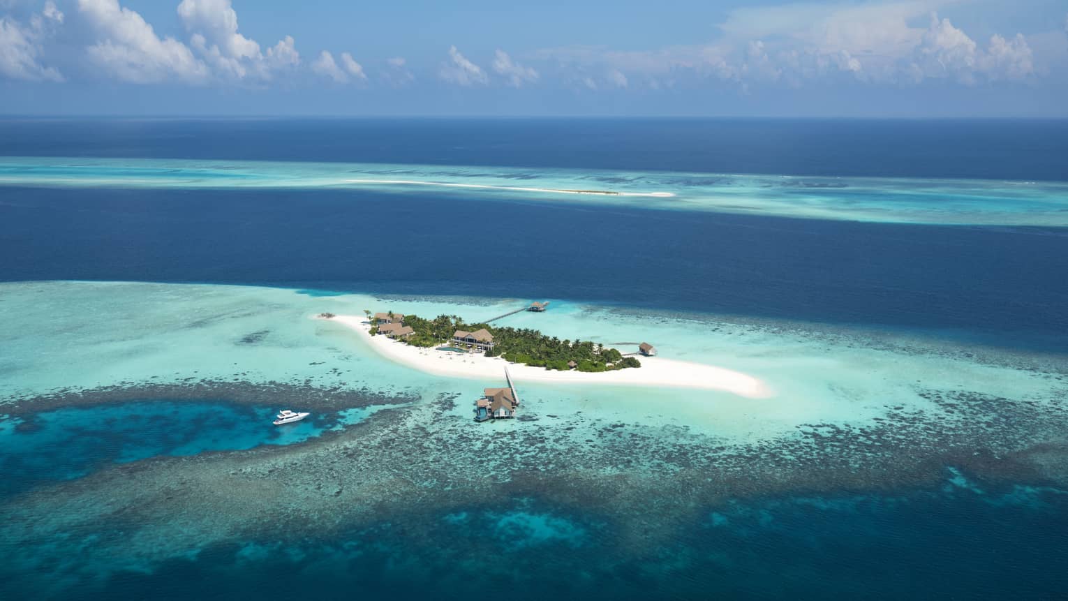 Voavah private island in the bright blue ocean