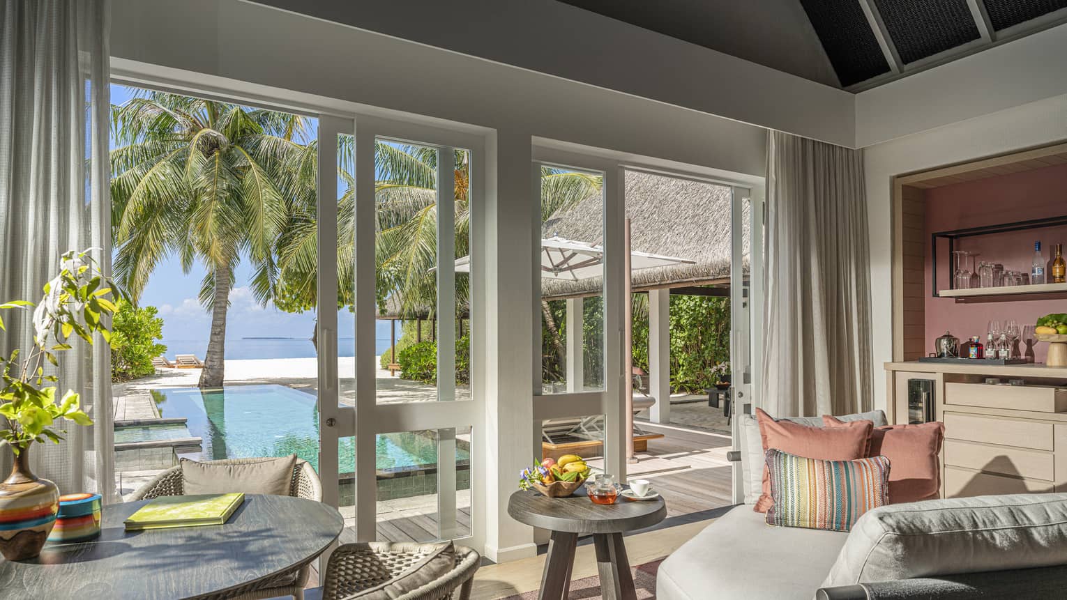 Indoor sitting area and wet bar, leading out to private pool terrace