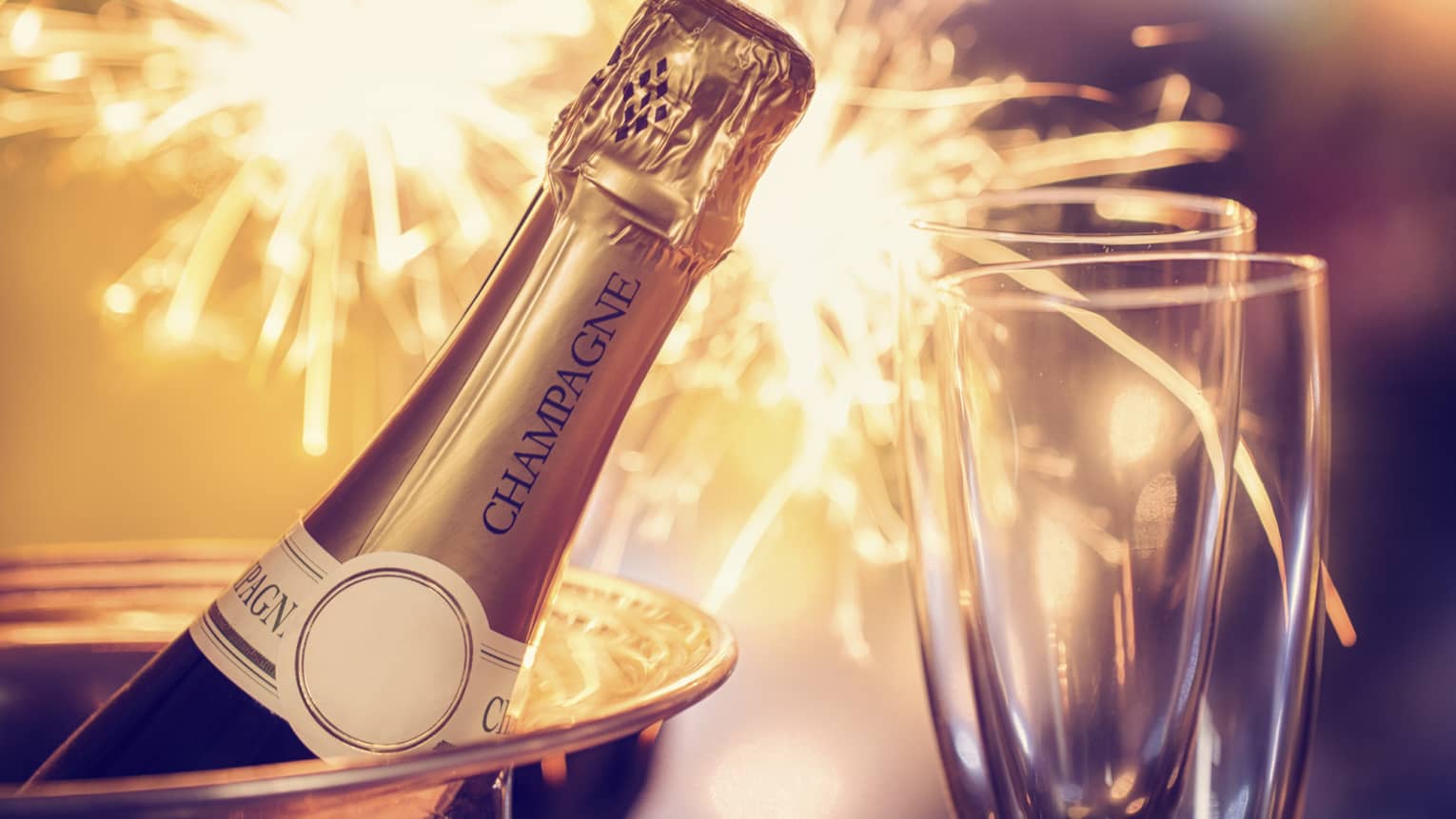 Fireworks, champagne and two champagne flutes