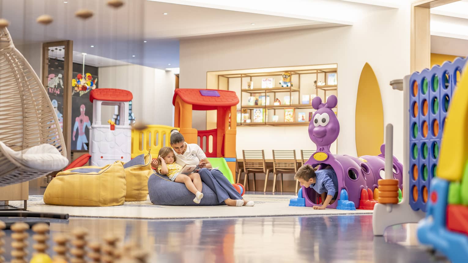 Kids playroom with colourful toys and bean-bag chairs
