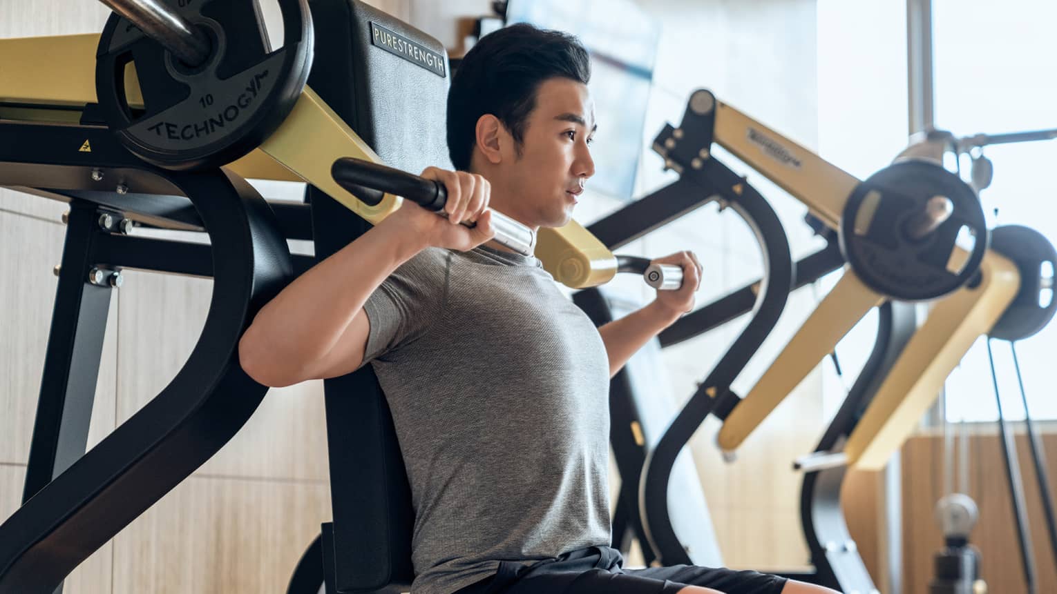 Guest using fitness equipment in gym at Four Seasons