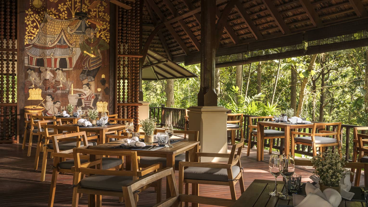 Rim Tai dining tables, chairs in open-air restaurant room