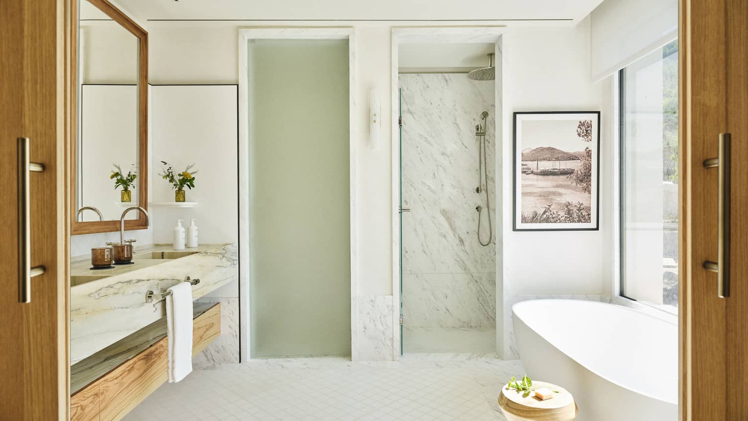Large marble bathroom with standalone tub, separate WC and separate shower at Four Seasons Resort Mallorca