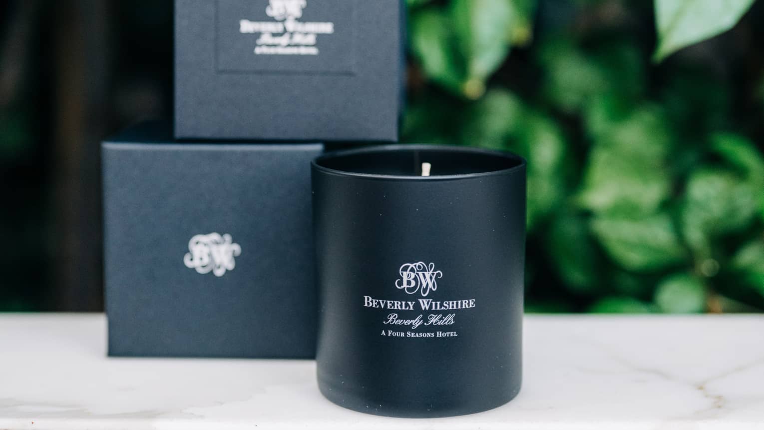 Candles on a white marble counter.