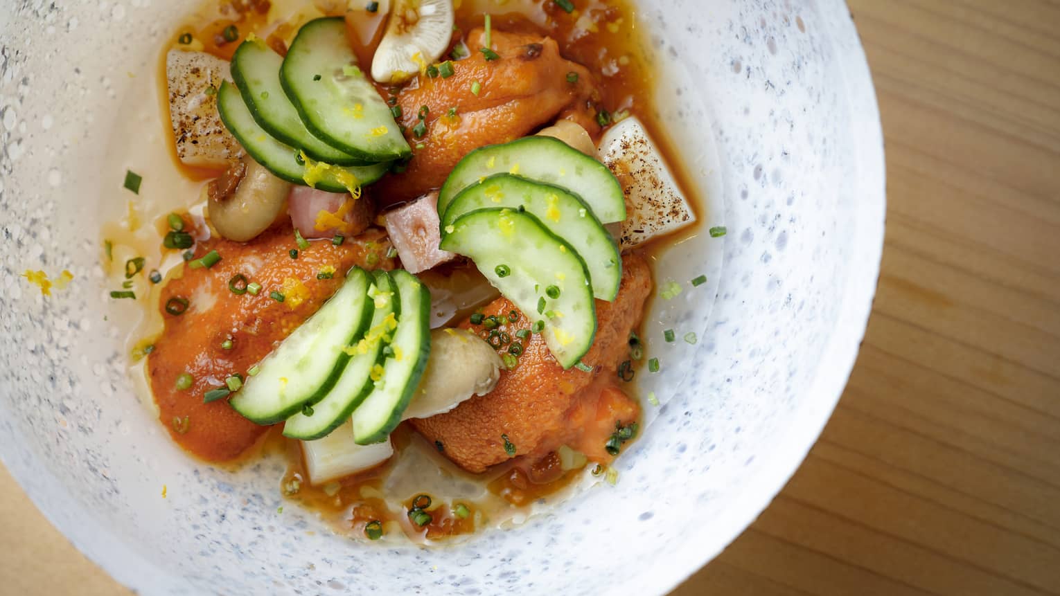 Chirashi Francaise dish on white plate, with cucumber and yuzu