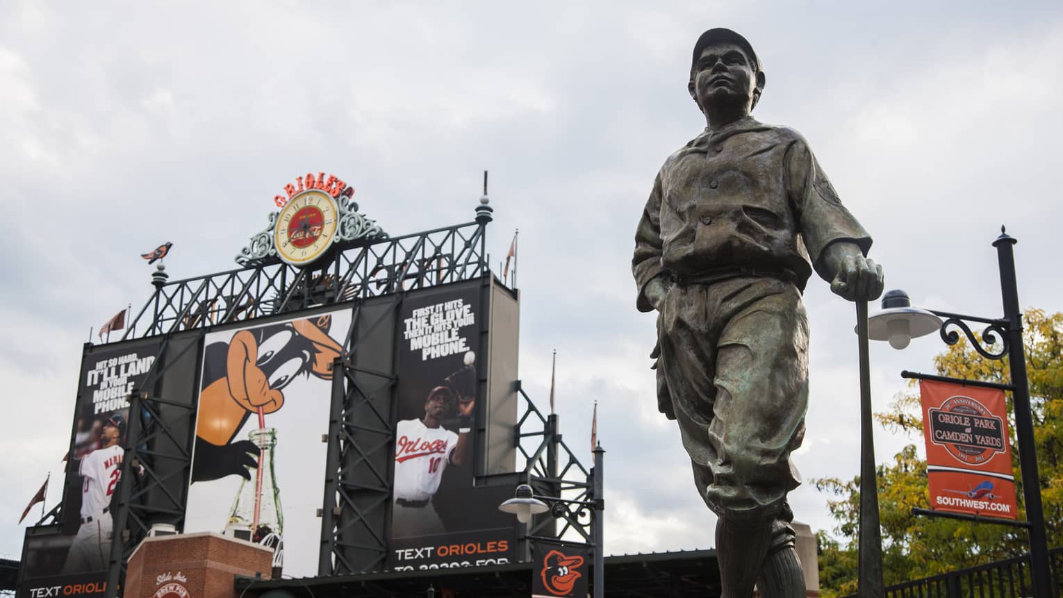 Baseball statue and gates of Oriole Park at Camden Yards