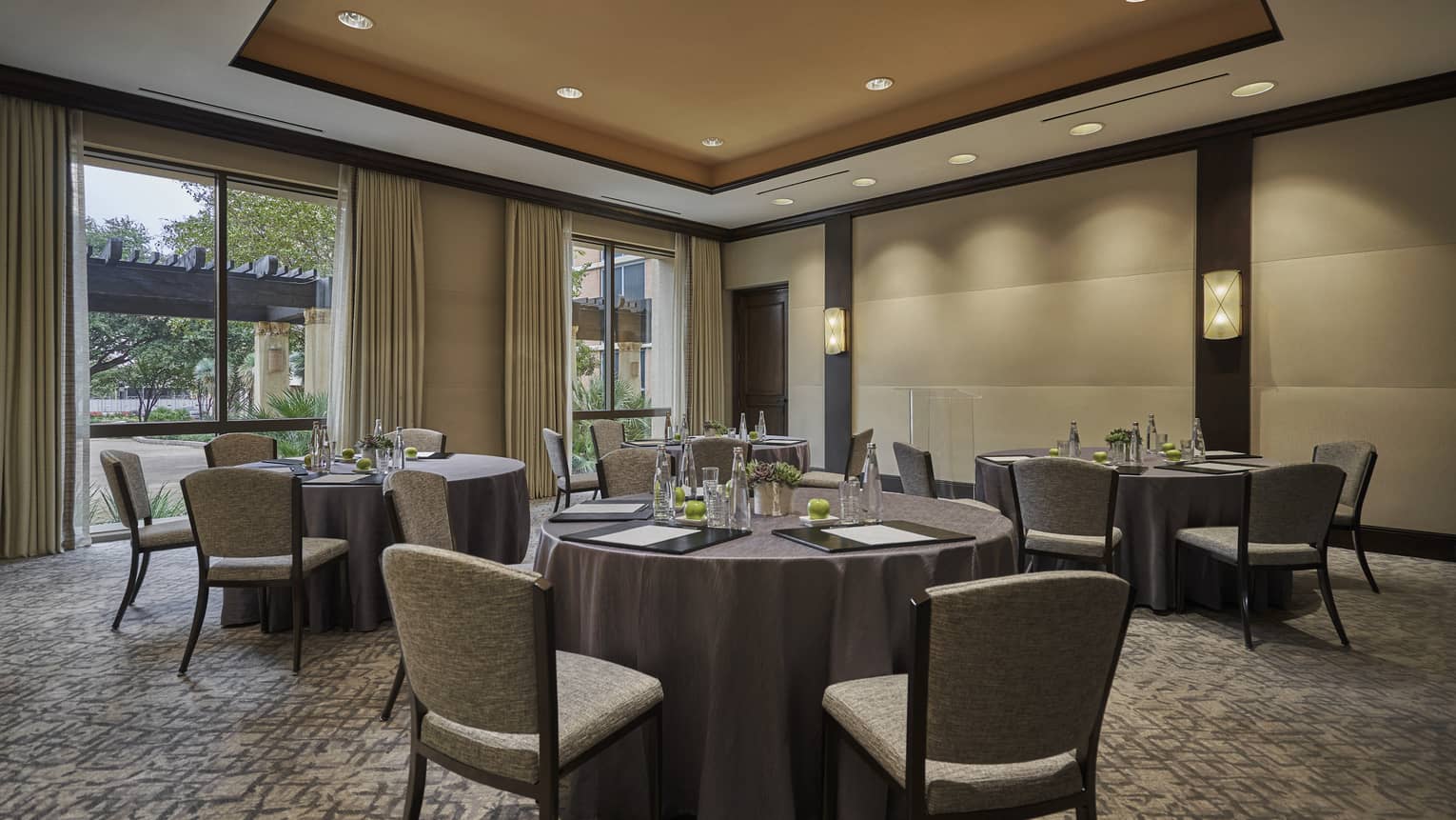 Small tables, chairs in Little Colony meeting room