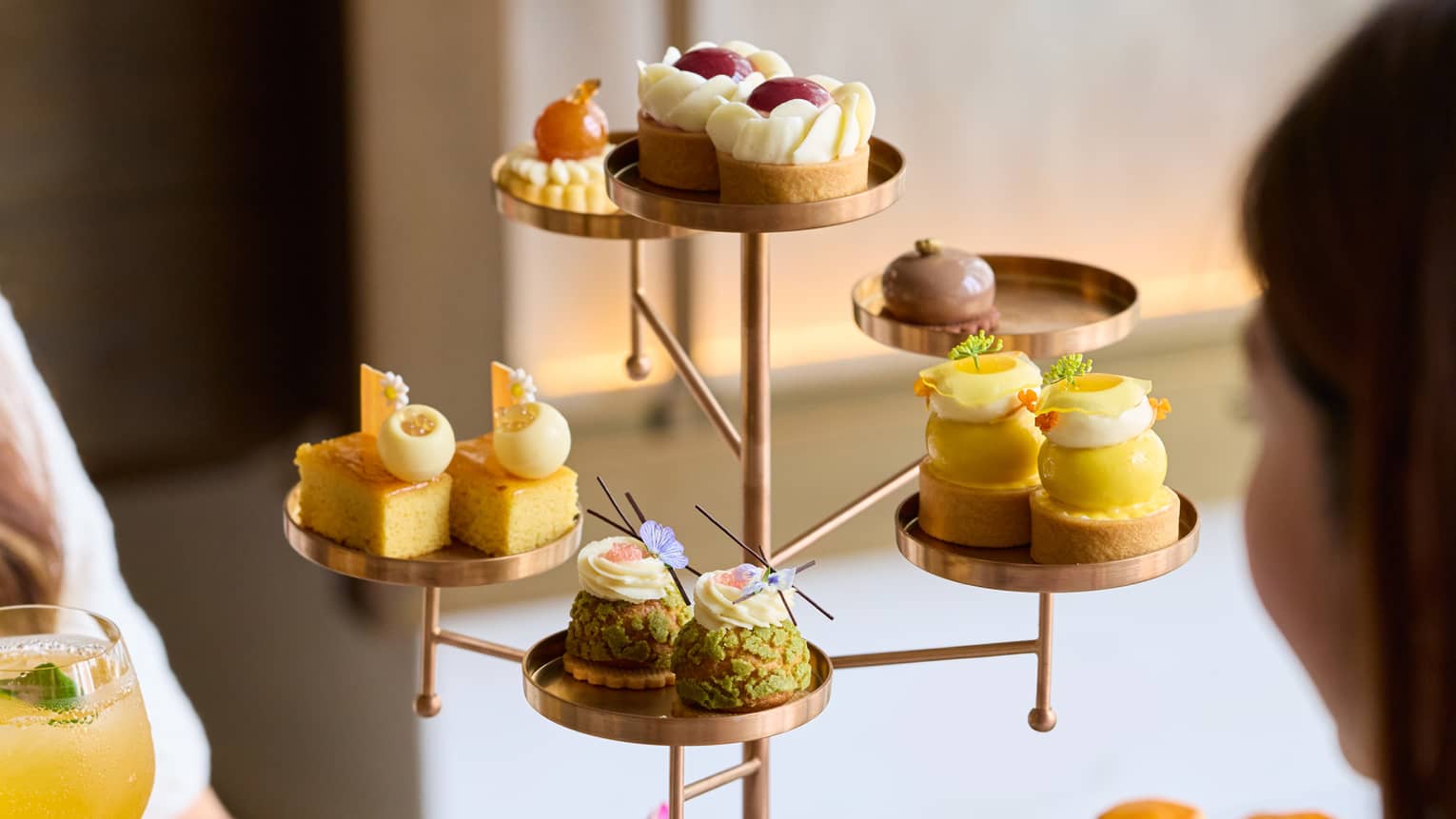 Tree-shapped serving tray filled with bite-sized pastries for afternoon tea