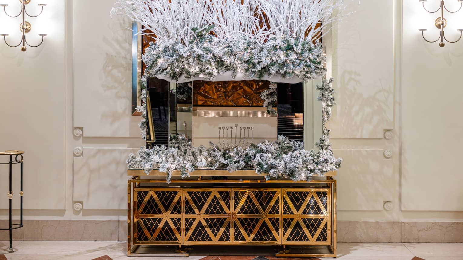 A menorah on a counter with festive decorations.