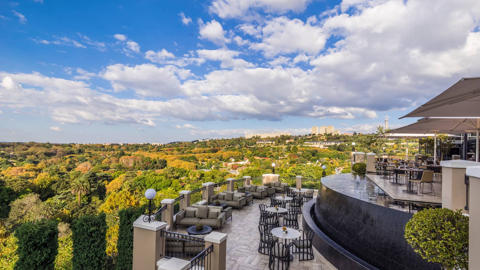 Curved View Restaurant patio overlooking green trees, forest