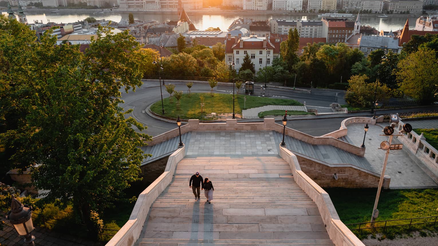 View of the city at sunset from atop steps of the hotel