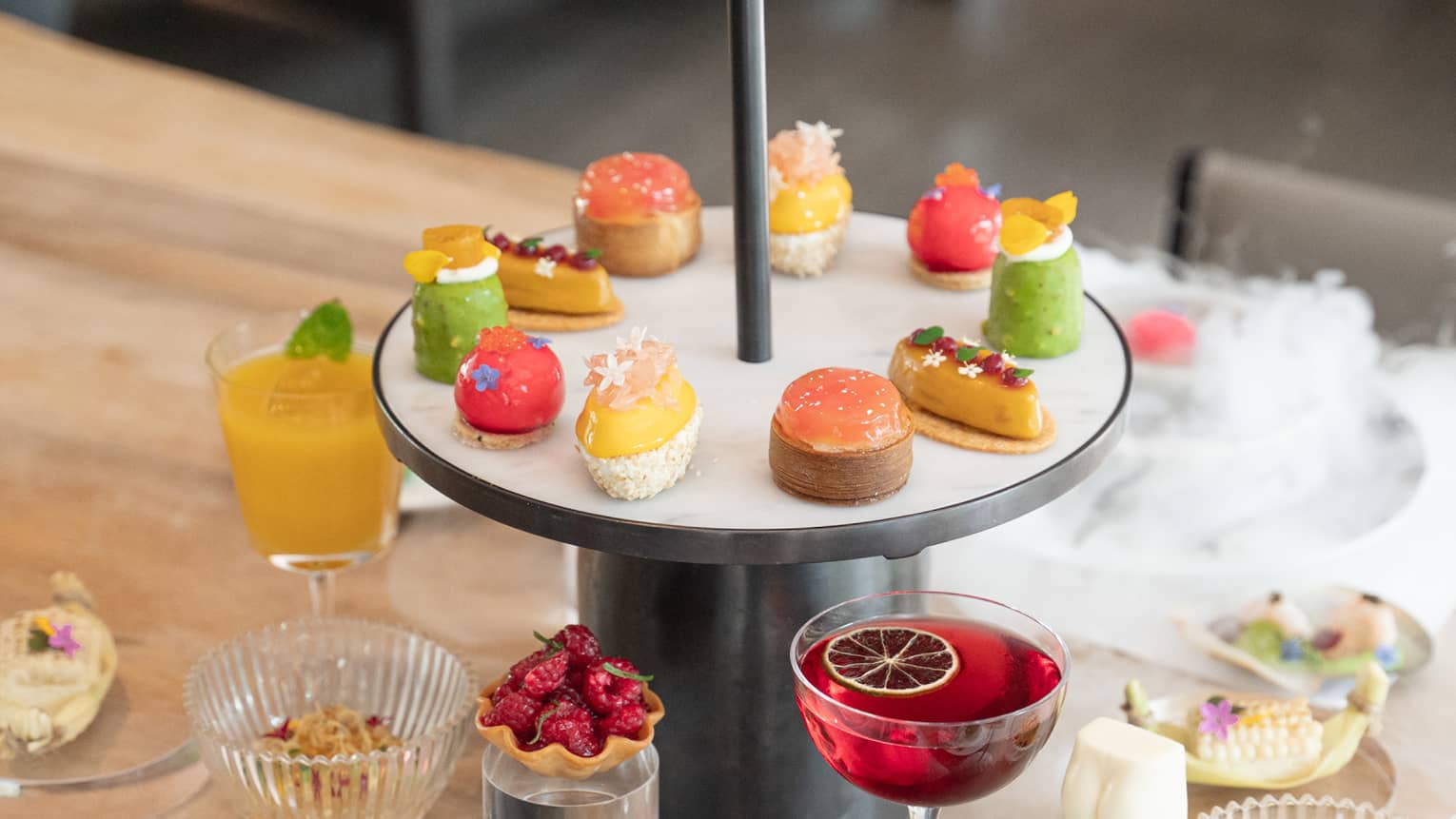 Single tier afternoon tea display with colourful sweet treats