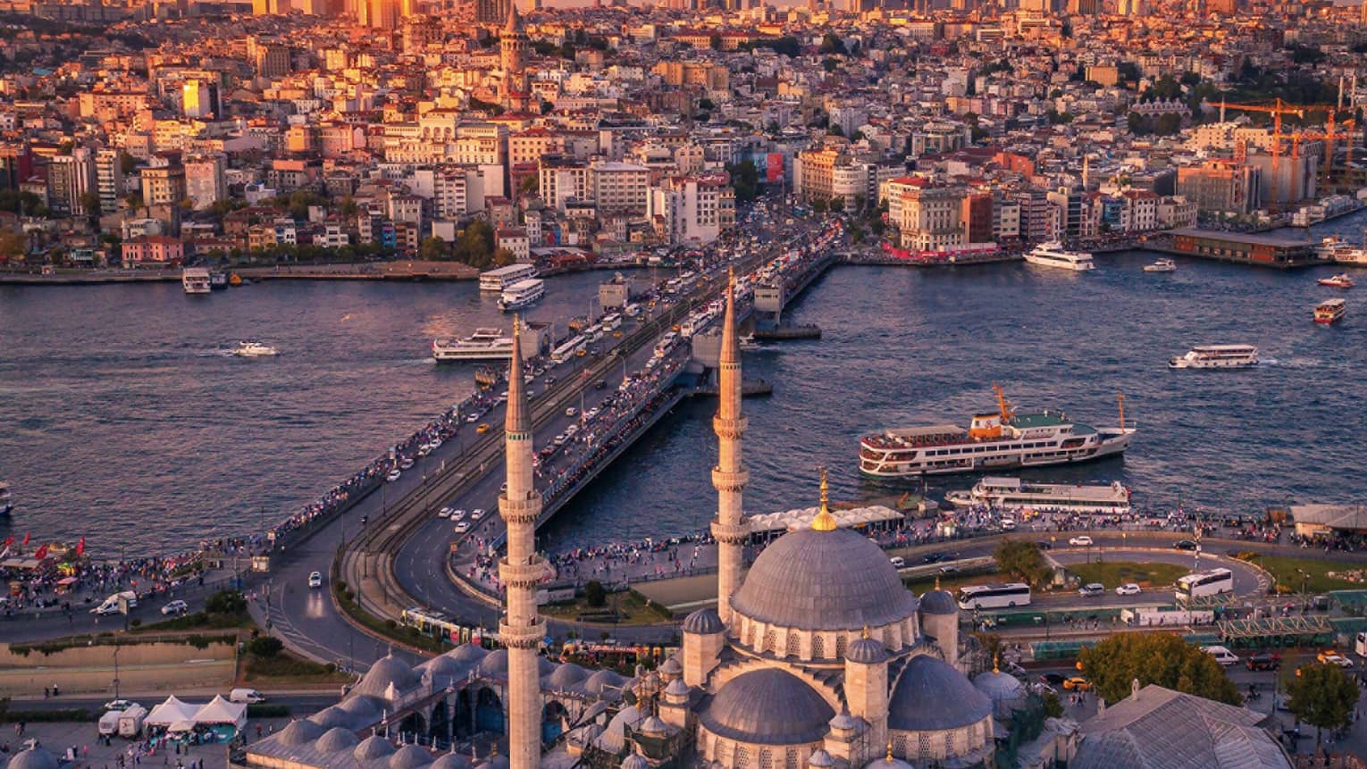 Aerial view of historic buildings and roads, city at sunset