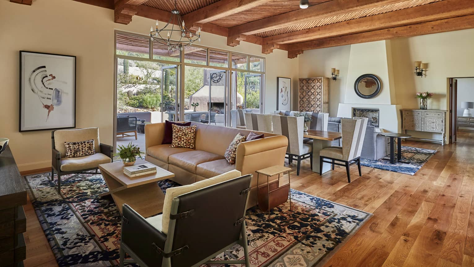 Living room and dining area, with rich wooden floors and beamed wooden ceiling