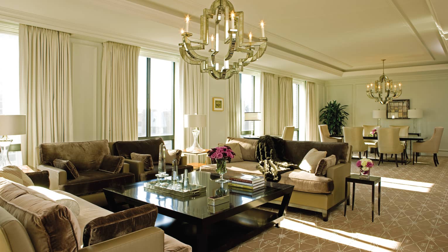 Presidential Suite West Wing large living room with brown, beige velvet sofas, bright picture windows