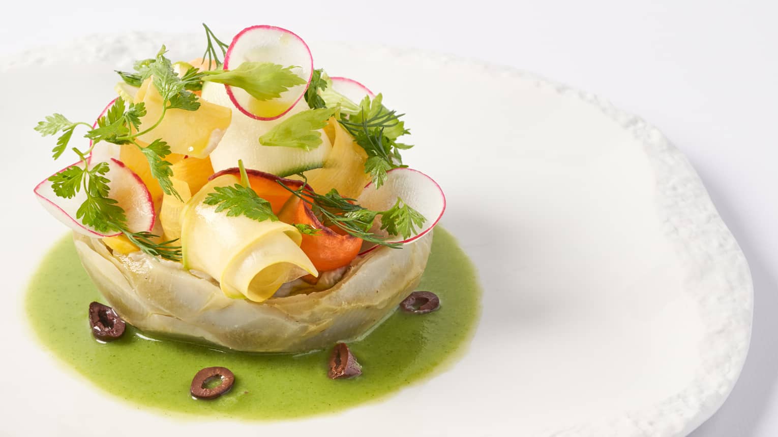  Camus artichokes in vinaigrette of young yegetables on white round plate