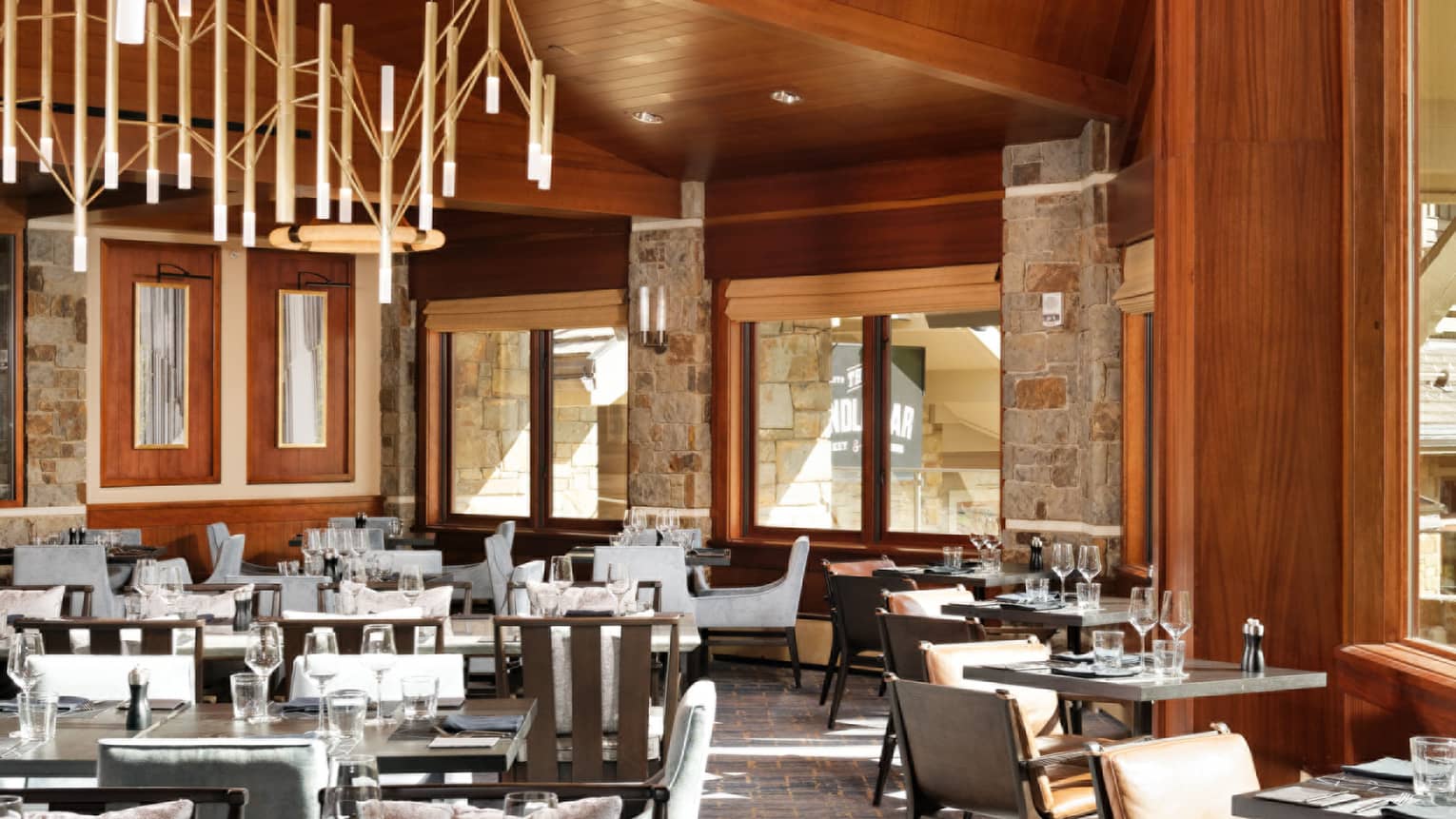 Empty restaurant, wooden ceiling and exposed beams, chandelier
