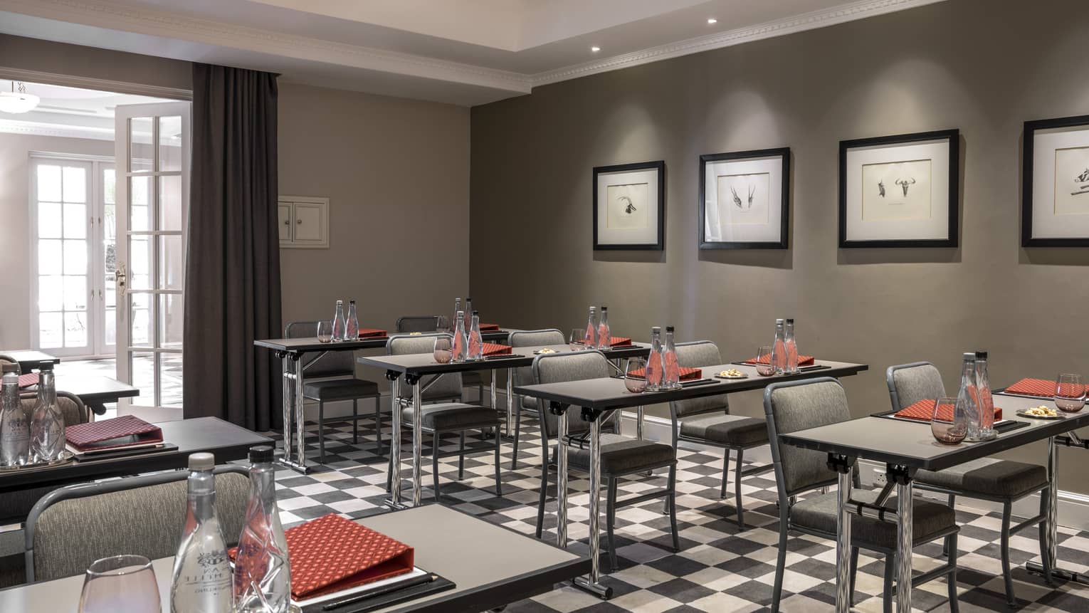Watsonia Meeting Room Classroom setup with small tables and chairs in rows 
