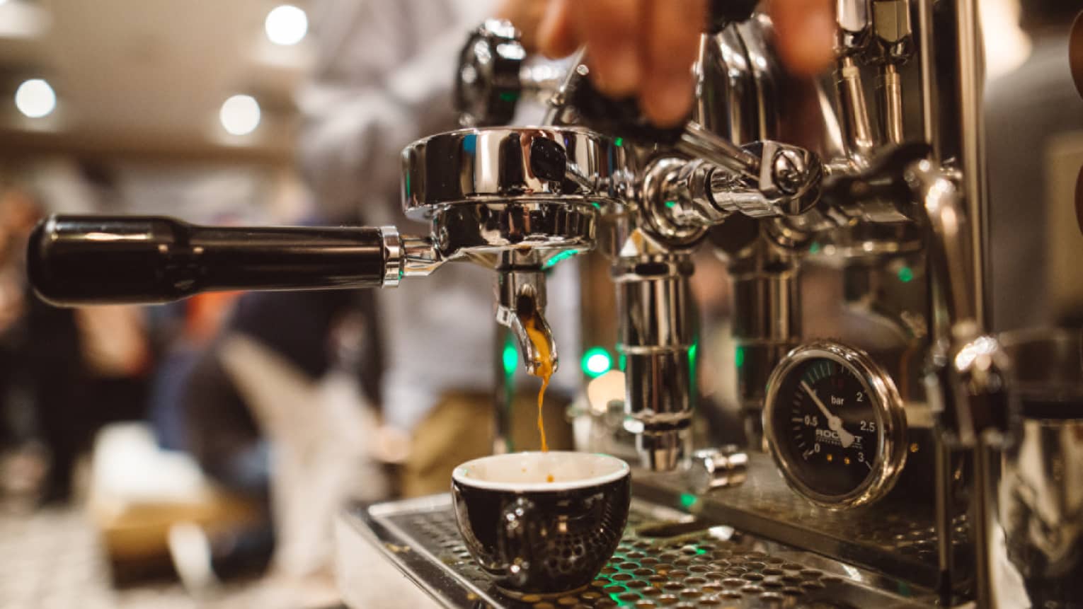 Espresso machine in use