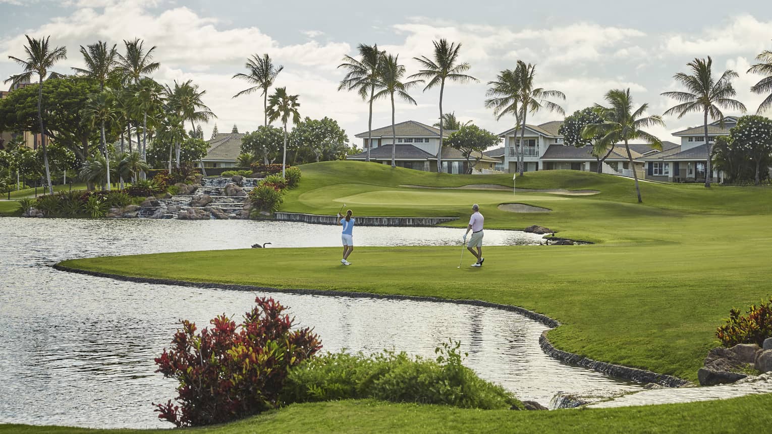 Two golfers playing on the Ko Olina course 