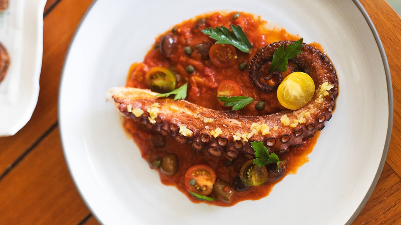 Octopus dish with vegetables on a plate
