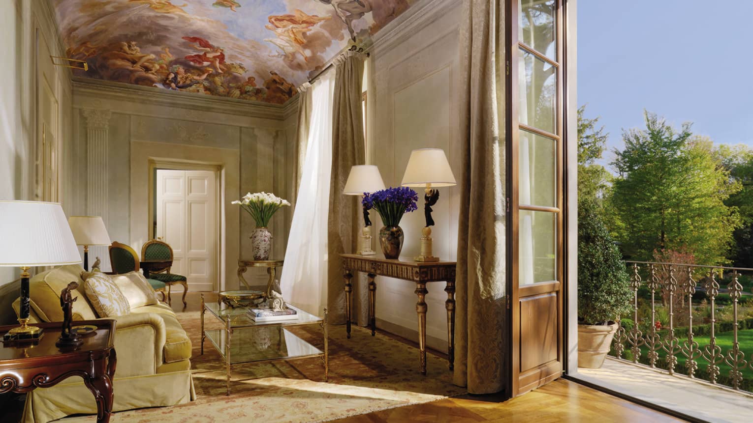 Presidential Suite sitting area under mural panel ceiling, open balcony door