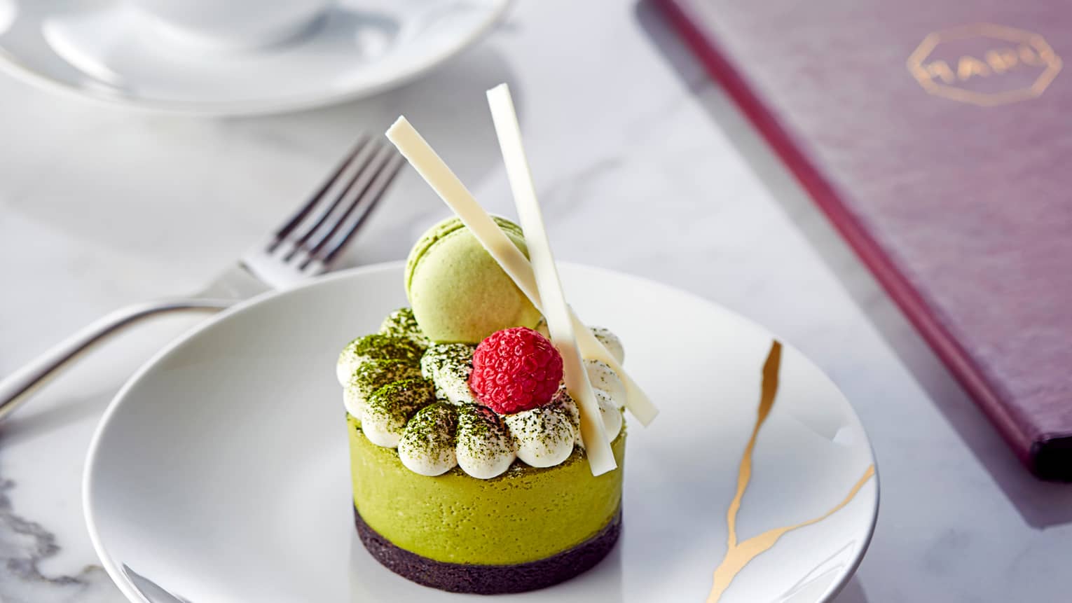 Close-up of green gourmet dessert cake by Maru menu